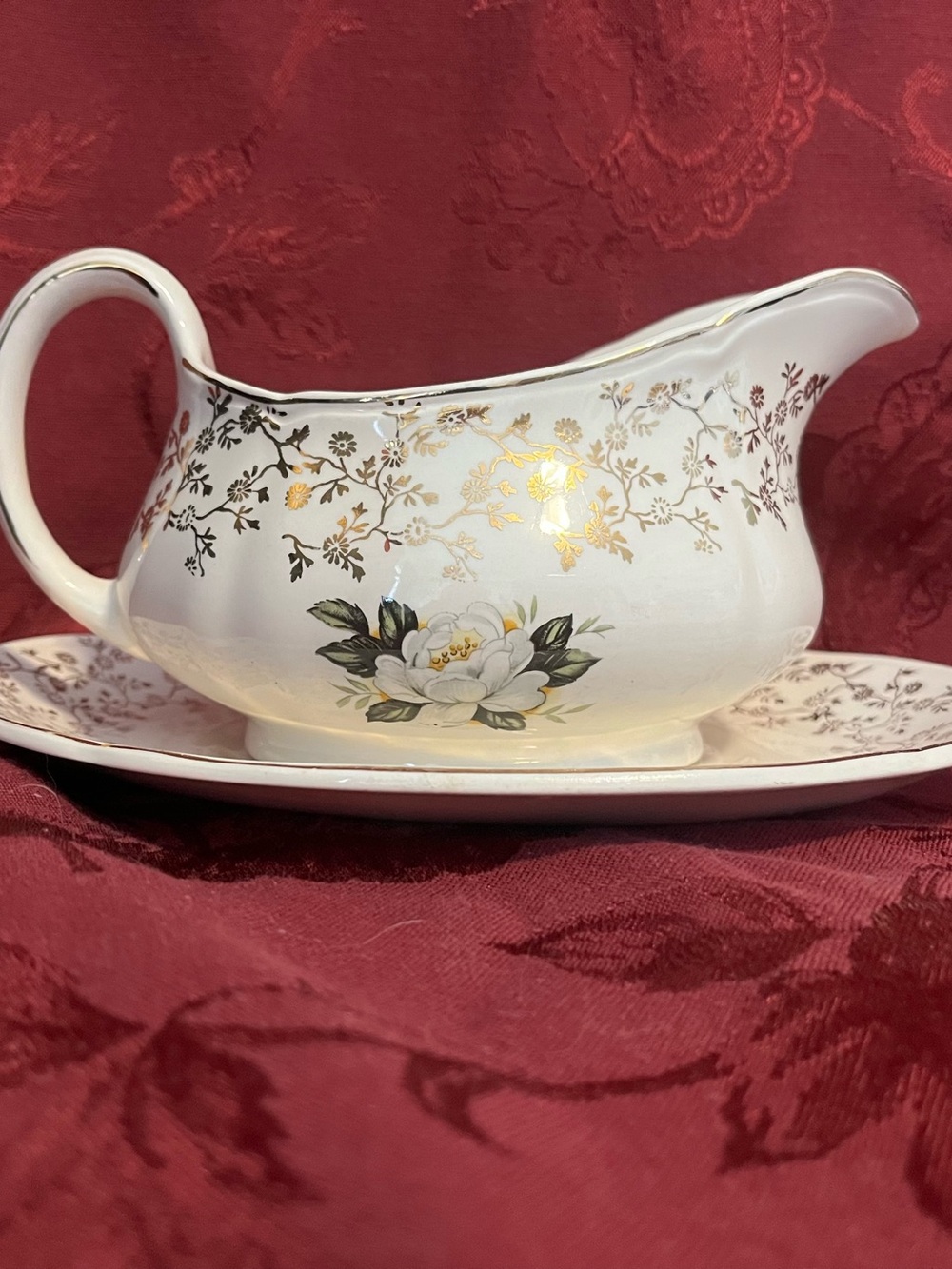 White Porcelain Gravy Boat with Gold Floral Accents and Underplate